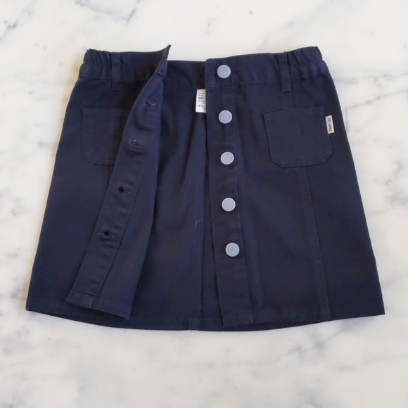 NWOT. John F. Gee Black Denim Skirt with Front Opening and Side Waist Elastic. - Picture 2 of 3